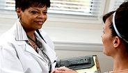 Female doctor and patient Female doctor and patient
